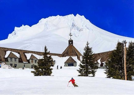 image of timberline lodge, and the palmer snowfield behind it